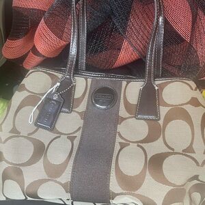 Beautiful coach dark brown shoulder bag with large C”s